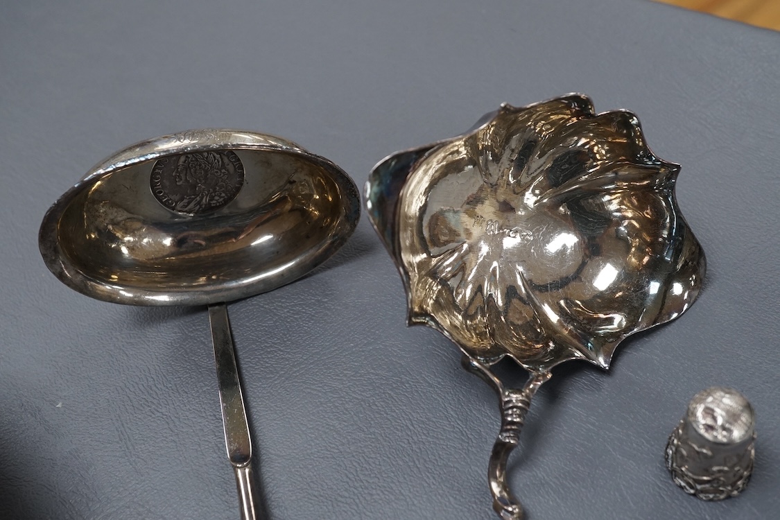 A small group of collectable silver including a George III silver cream jug, London, 1804, height 95mm, three silver vesta cases, two pill boxes, an envelope stamp case, two Georgian toddy ladles, one unmarked, together